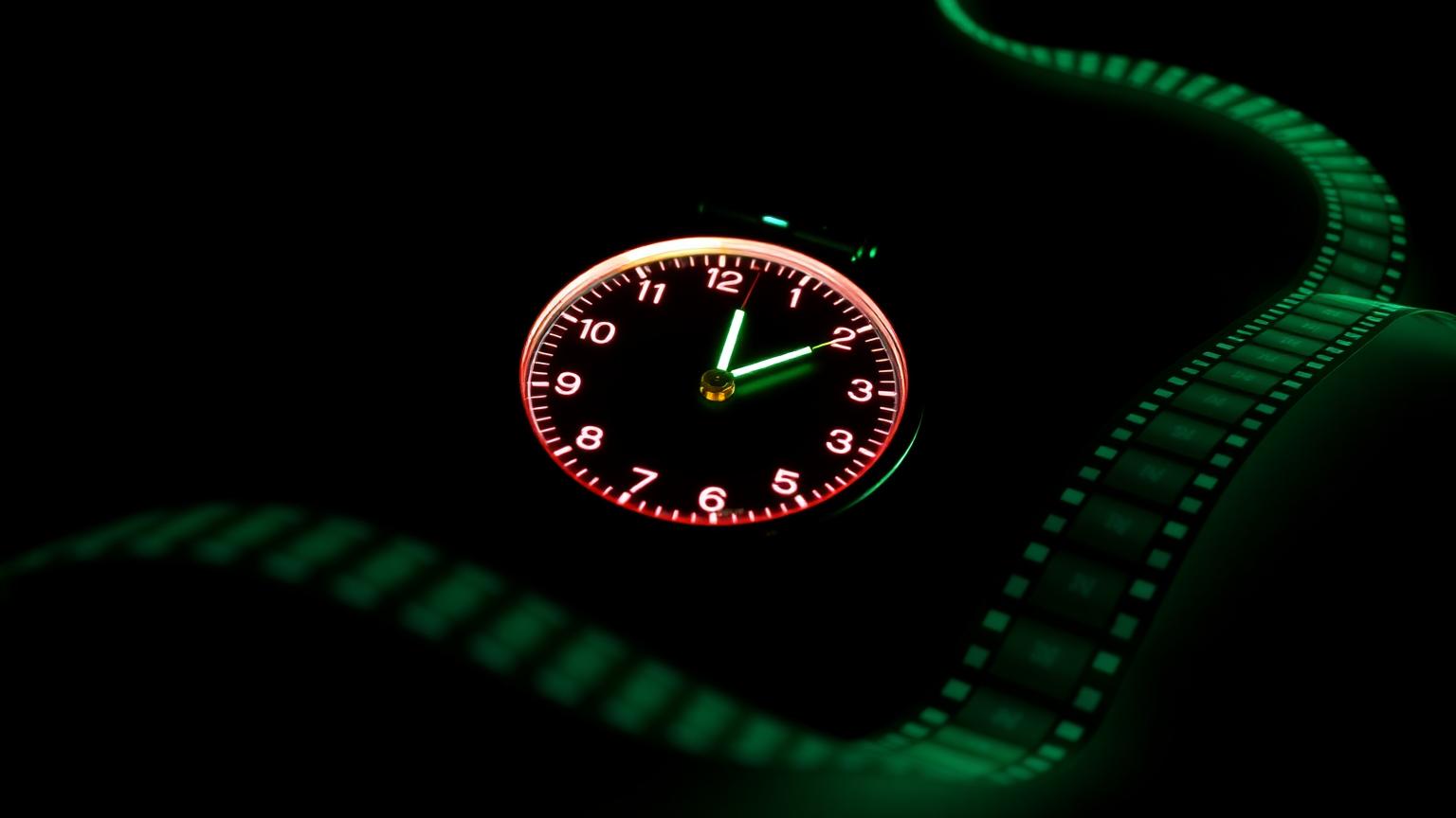 Stopwatch dissolving into a film strip